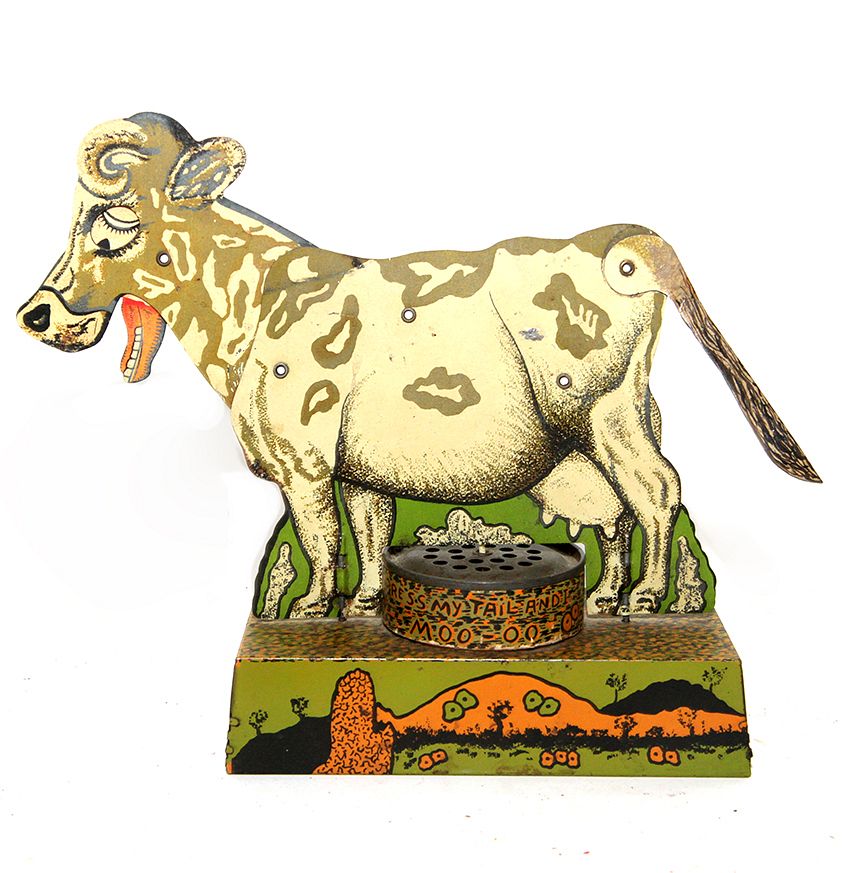 Appraisal: Press My Tail Cow Tin Toy A mechanical tin toy