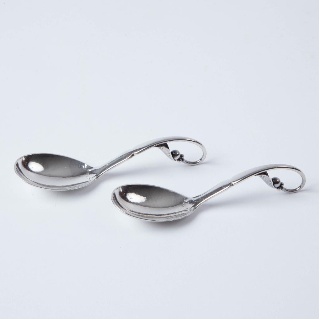 Appraisal: TWO GEORG JENSEN STERLING PEA POD SPOONS Three dimensional leaf