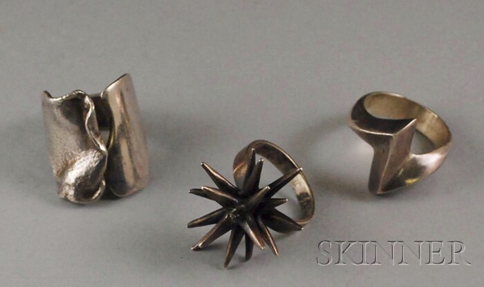 Appraisal: Three Modernist and Contemporary Sterling Silver Rings one Buch Deichmann-Bagsvaerd