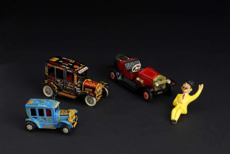 Appraisal: Lot of Tin Automobile Toys Description Japanese Both friction cars