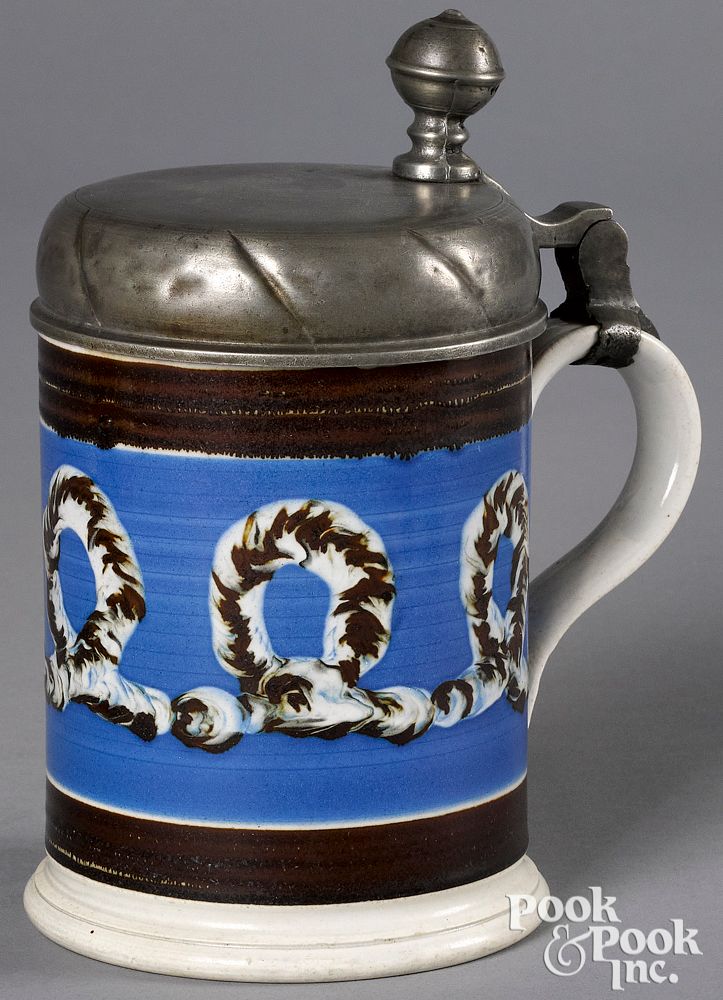 Appraisal: Mocha tankard Mocha tankard with earthworm decoration and pewter lid