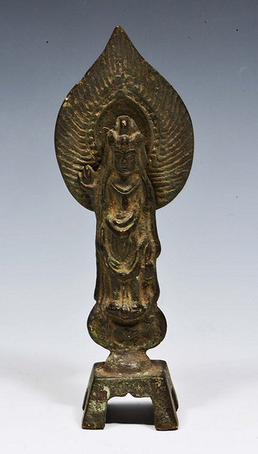 Appraisal: A JAPANESE BRONZE FIGURE OF KANNAN standing holding a miniature