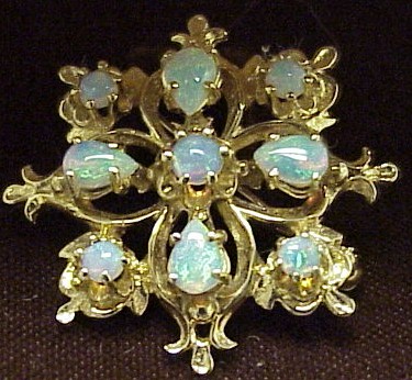 Appraisal: JEWELRY K yellow gold opal pin pendant set with one