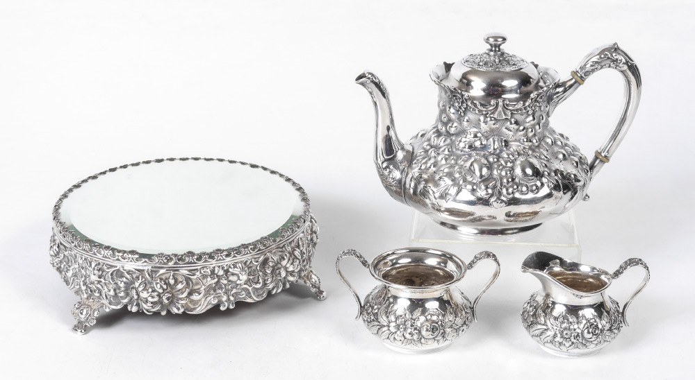 Appraisal: KIRK SON STERLING REPOUSSE SUGAR AND CREAMER pieces total to