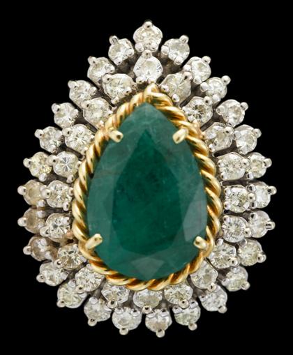 Appraisal: Platinum emerald and diamond dinner ring Pear shaped emerald with