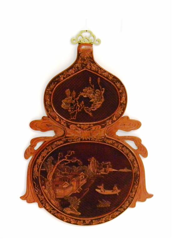 Appraisal: Chinese red cinnabar wall plaque two stacked medallions joined by