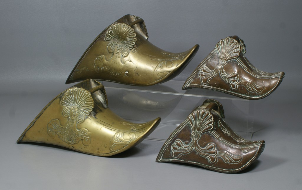 Appraisal: pr brass stirrups cast and engraved decoration long