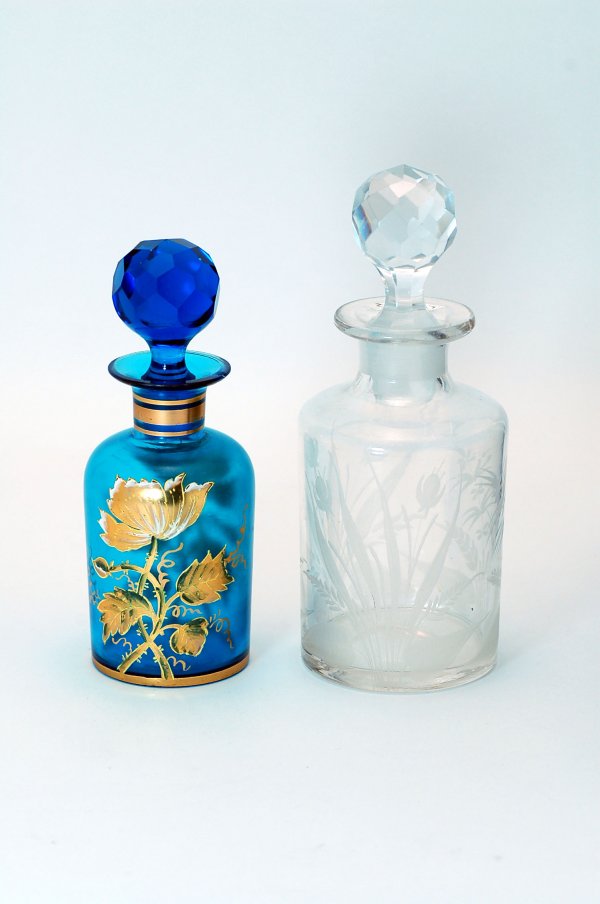 Appraisal: Two th century glass colognes with faceted stoppers one clear