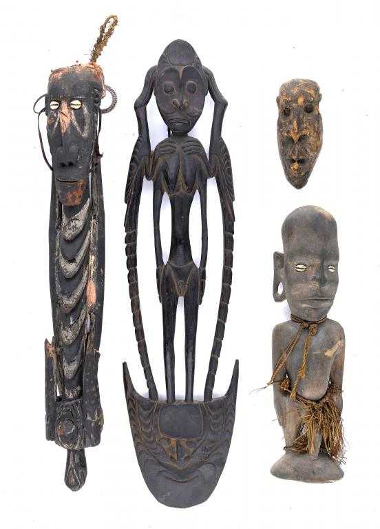 Appraisal: TRIBAL ART THREE WOODEN CARVINGS PAPUA NEW GUINEA comprising two