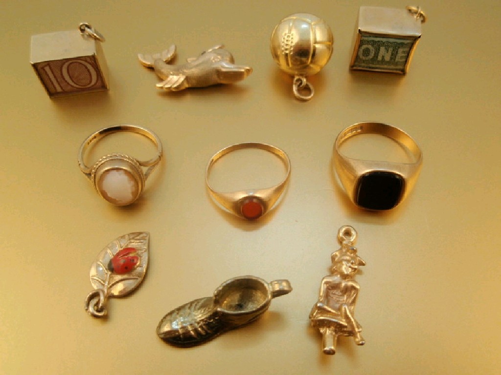 Appraisal: Three dress rings and various bracelet charms