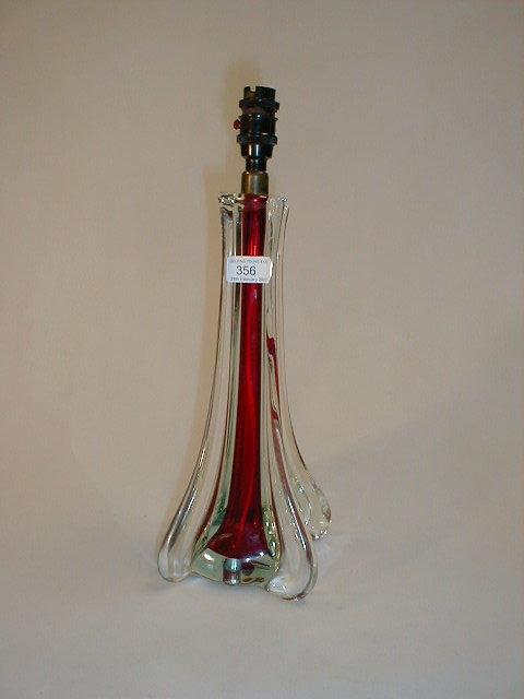 Appraisal: A Murano lamp base cased ruby glass excluding fitting