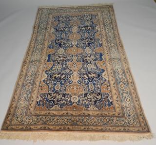 Appraisal: Iranian silk and wool rug Iranian silk and wool rug-