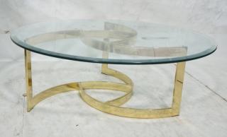 Appraisal: Round Glass Cocktail Table Gold Tone flat metal curved base