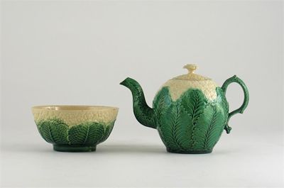 Appraisal: A cauliflower moulded teapot and cover with a matching bowl