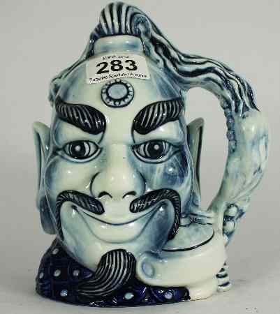 Appraisal: Royal Doulton Large Blue Flambe Character Jug Aladdins Genie ''Not