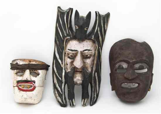 Appraisal: A Group of Three Mexican Wood Masks having polychrome decoration