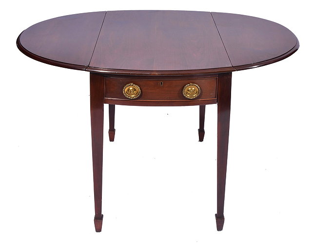 Appraisal: A SHERATON STYLE MAHOGANY OVAL PEMBROKE TABLE with end drawer