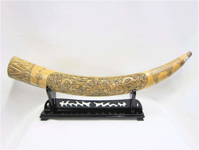 Appraisal: CHINESE HAND CARVED BONE VENEERED TUSK with wooden stand Measures