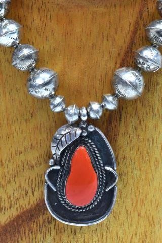 Appraisal: Native American silver content unknown pendant necklace red orange inset