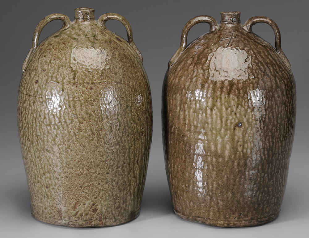 Appraisal: Two Similar Alkaline-Glazed Stoneware Jugs American th century each with