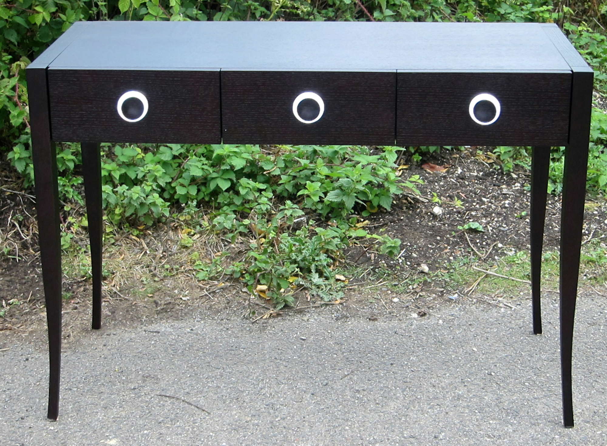 Appraisal: Black stained oak hall table with three drawers on square