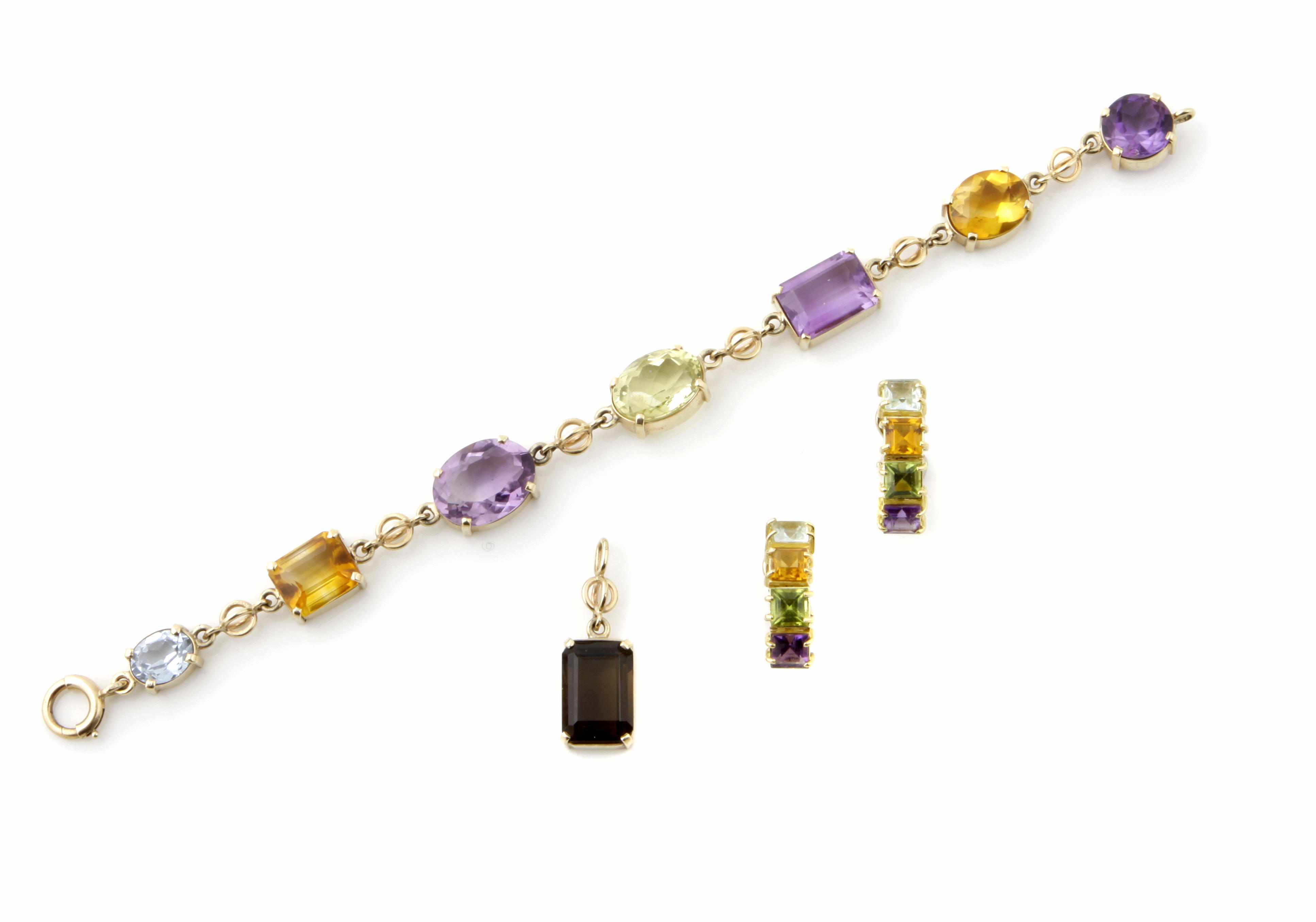 Appraisal: A group of gem-set and gold jewelry comprising a pendant