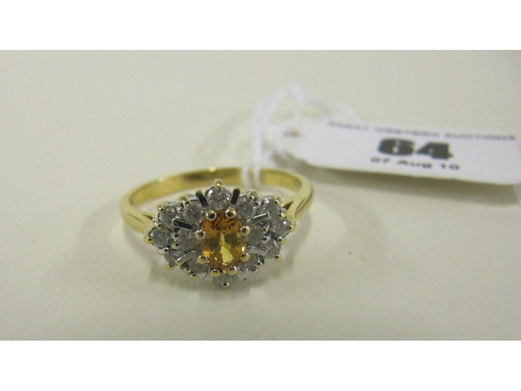 Appraisal: Eighteen carat gold yellow sapphire and diamond cluster ring central