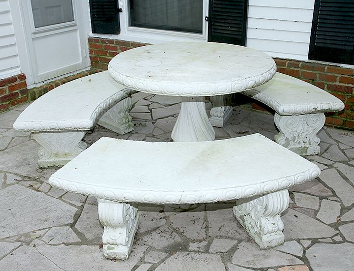 Appraisal: Concrete Patio Set A concrete table with three benches