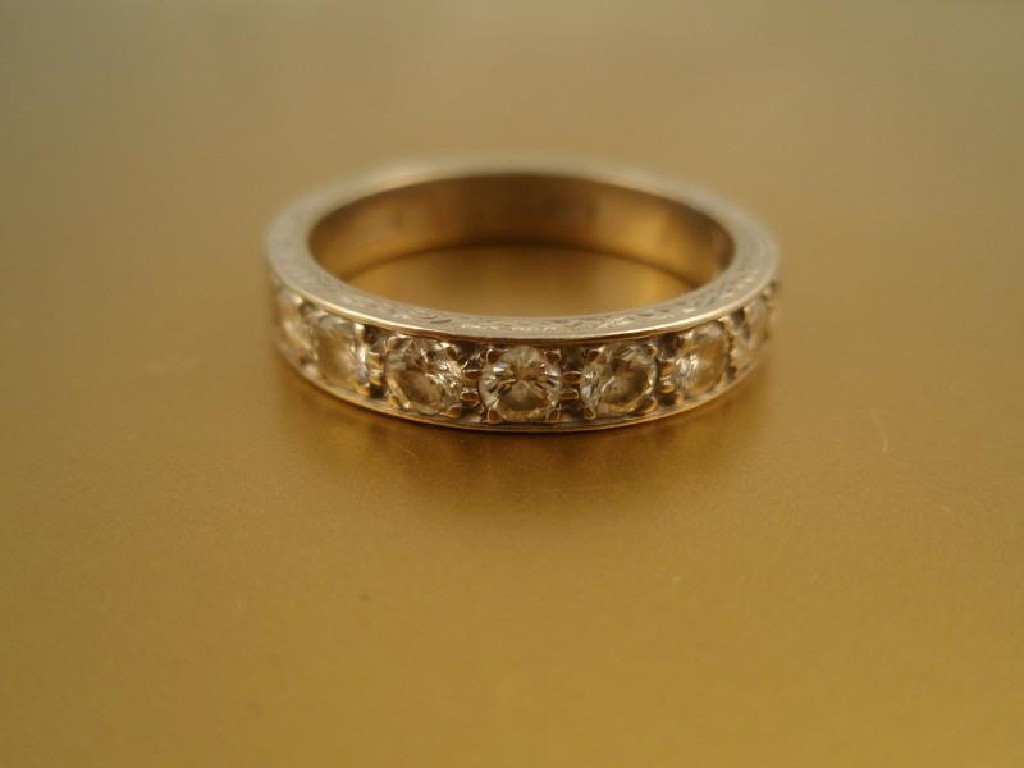 Appraisal: A half hoop diamond set eternity ring nine diamonds of