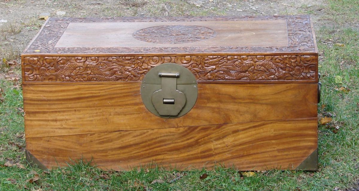 Appraisal: CHINESE CARVED BRASS-BOUND CAMPHOR WOOD CHEST th Century With carved