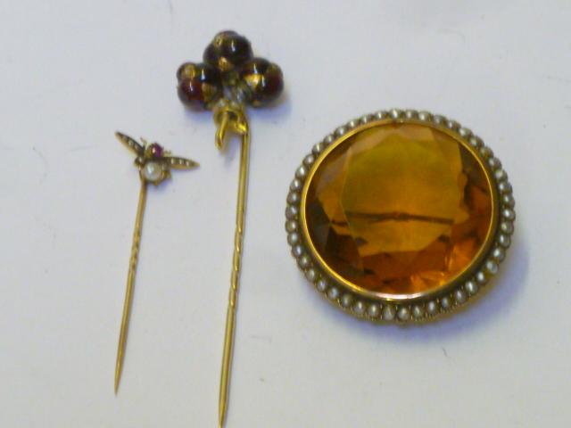 Appraisal: TWO VICTORIAN STICK PINS one applied with three garnet berries