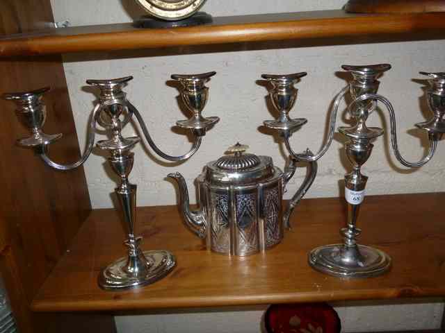 Appraisal: A PAIR OF THREE BRANCH SILVER PLATED CANDELABRA high together