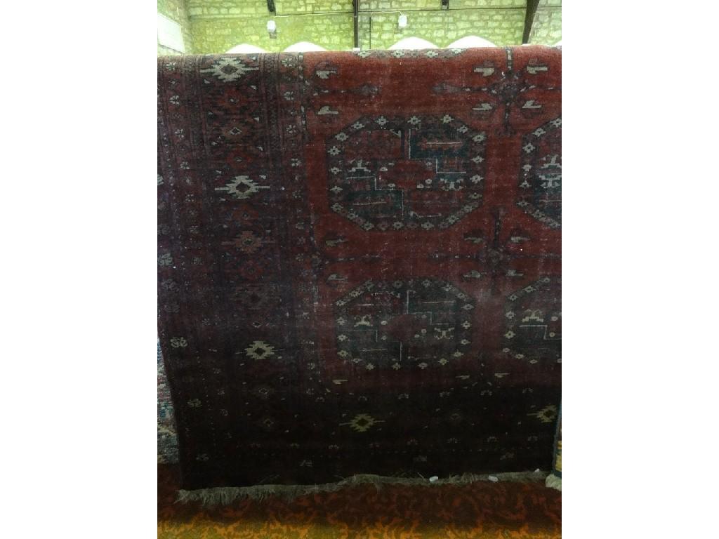 Appraisal: An Afghan carpet with three rows of six elephant foot