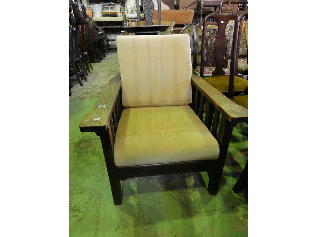 Appraisal: An Arts Crafts style oak reclining armchair with slatted side