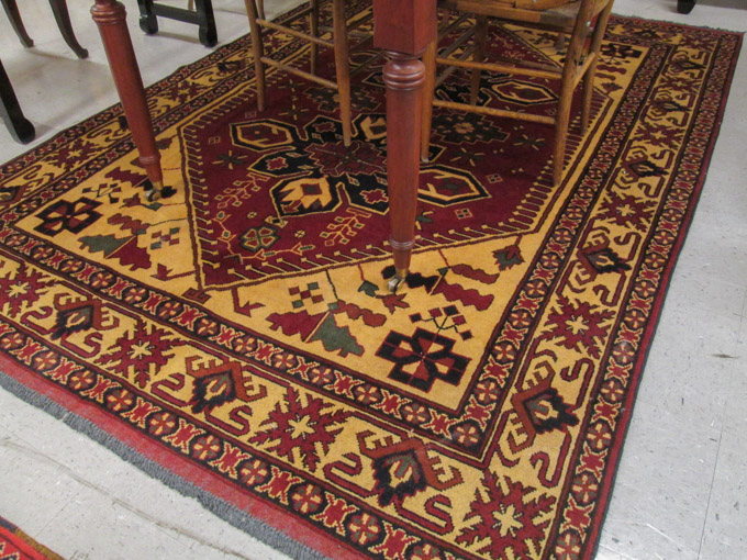 Appraisal: HAND KNOTTED ORIENTAL CARPET Pakistani Carghai tribal double geometric medallion