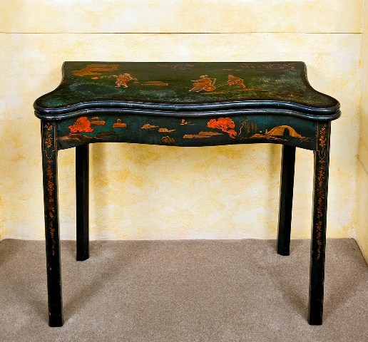 Appraisal: A George III green japanned serpentine card table the shaped