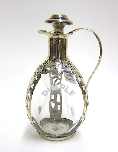 Appraisal: STERLING SILVER OVERLAY GLASS CRUET Mexico sterling with embossed and