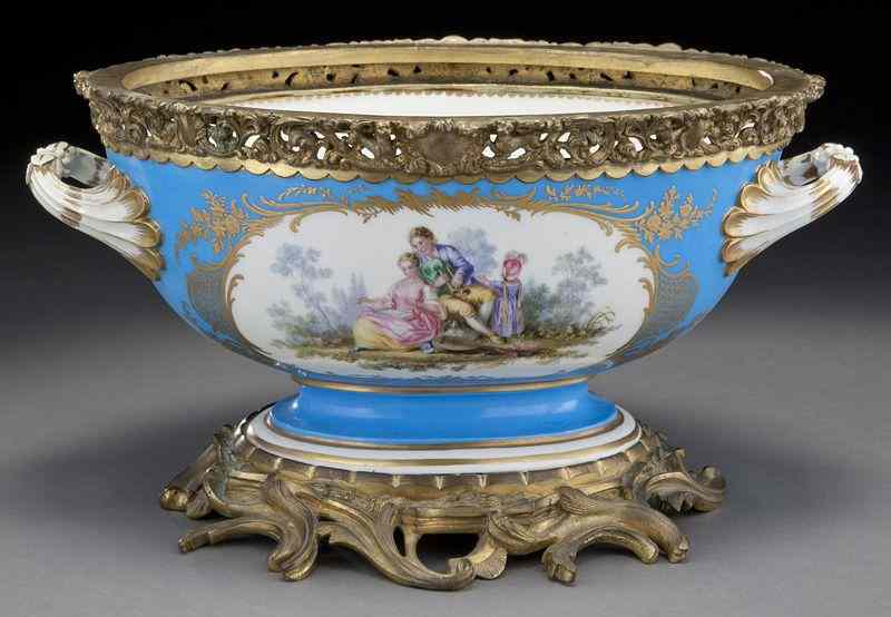 Appraisal: Sevres style porcelain centerpiece having a cobaltground the central reserve