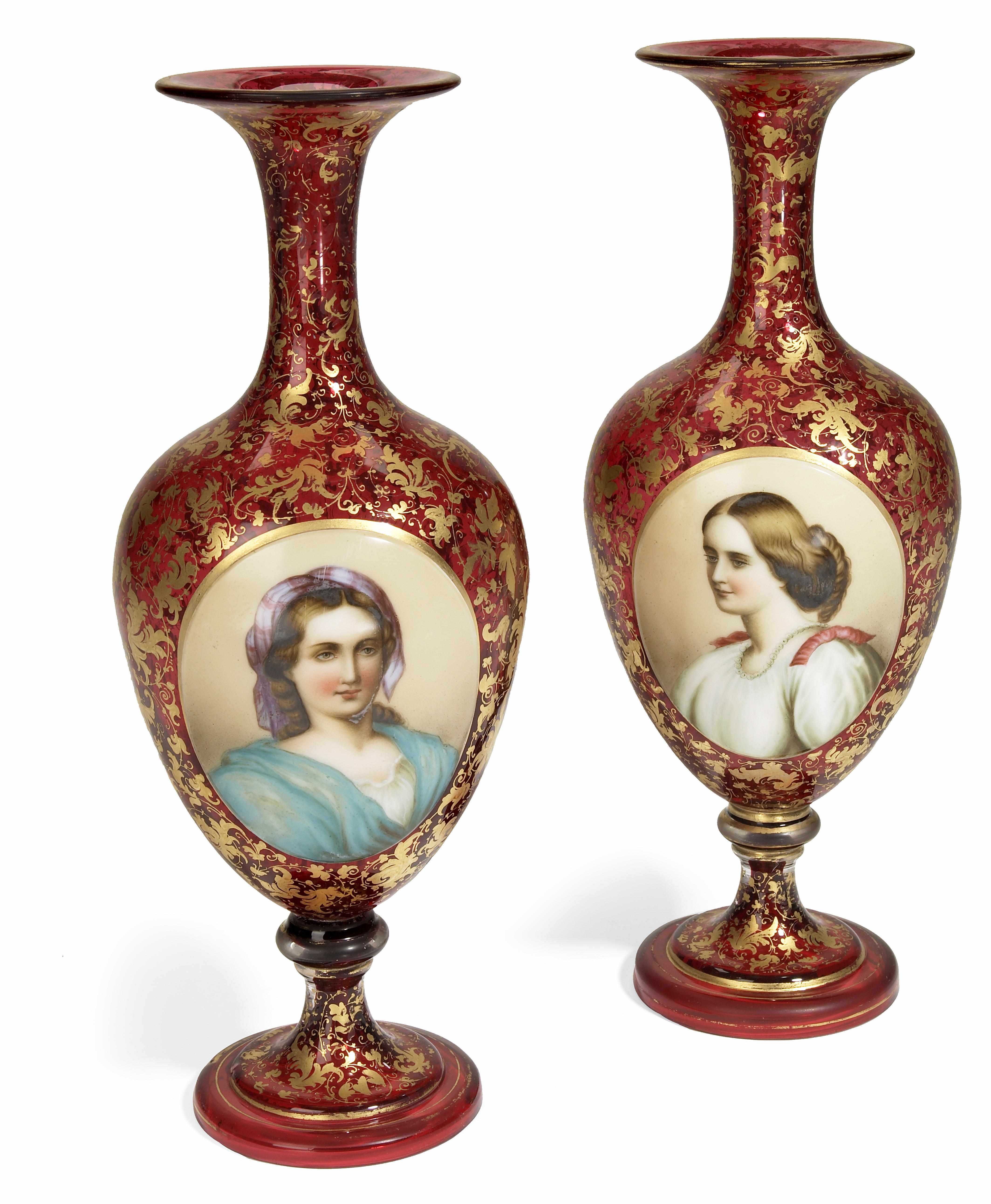 Appraisal: A pair of Bohemian gilt heightened cranberry glass vases late