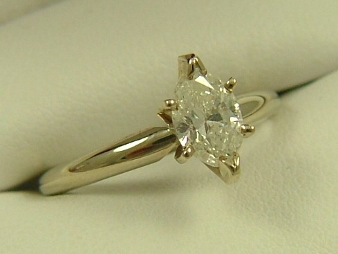 Appraisal: DIAMOND SOLITAIRE RING K yellow gold estimated weight marquise-cut diamond