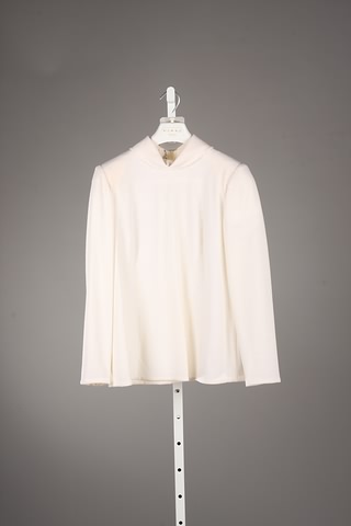 Appraisal: Andr Laug ivory long sleeve long wool top with roll