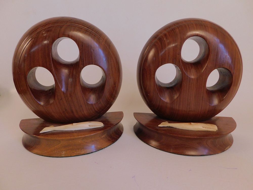 Appraisal: ROSEWOOD WHALE BONE BOOKENDS Pair of fine quality rosewood deadeye-form