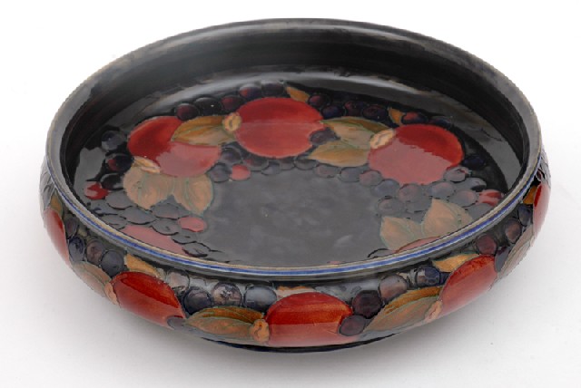 Appraisal: A SUBSTANTIAL MOORCROFT POMEGRANATE PATTERN BOWL Circa Circular footed bowl