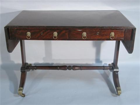 Appraisal: REGENCY CROSS-BANDED MAHOGANY SOFA TABLE The rectangular top with reeded