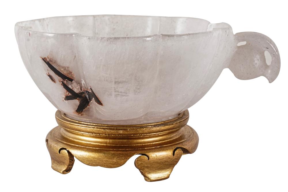 Appraisal: FLUTED ROCK CRYSTAL BOWLwith foliate handle on a giltwood base