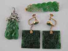 Appraisal: A mixed lot comprising a carved jade pendant with white