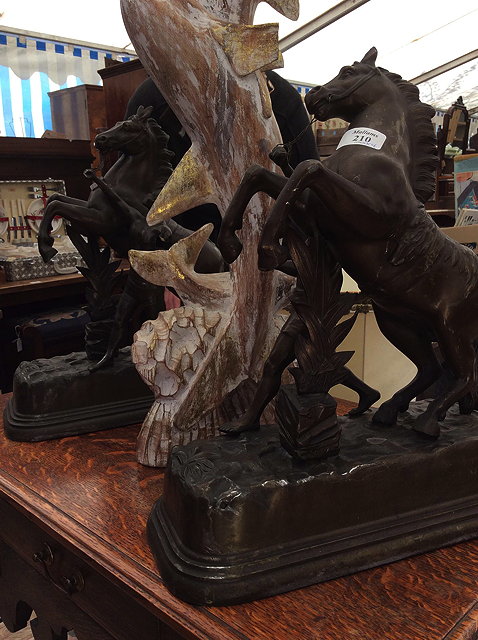 Appraisal: A PAIR OF BRONZED MARLEY REARING HORSE SCULPTURES together with