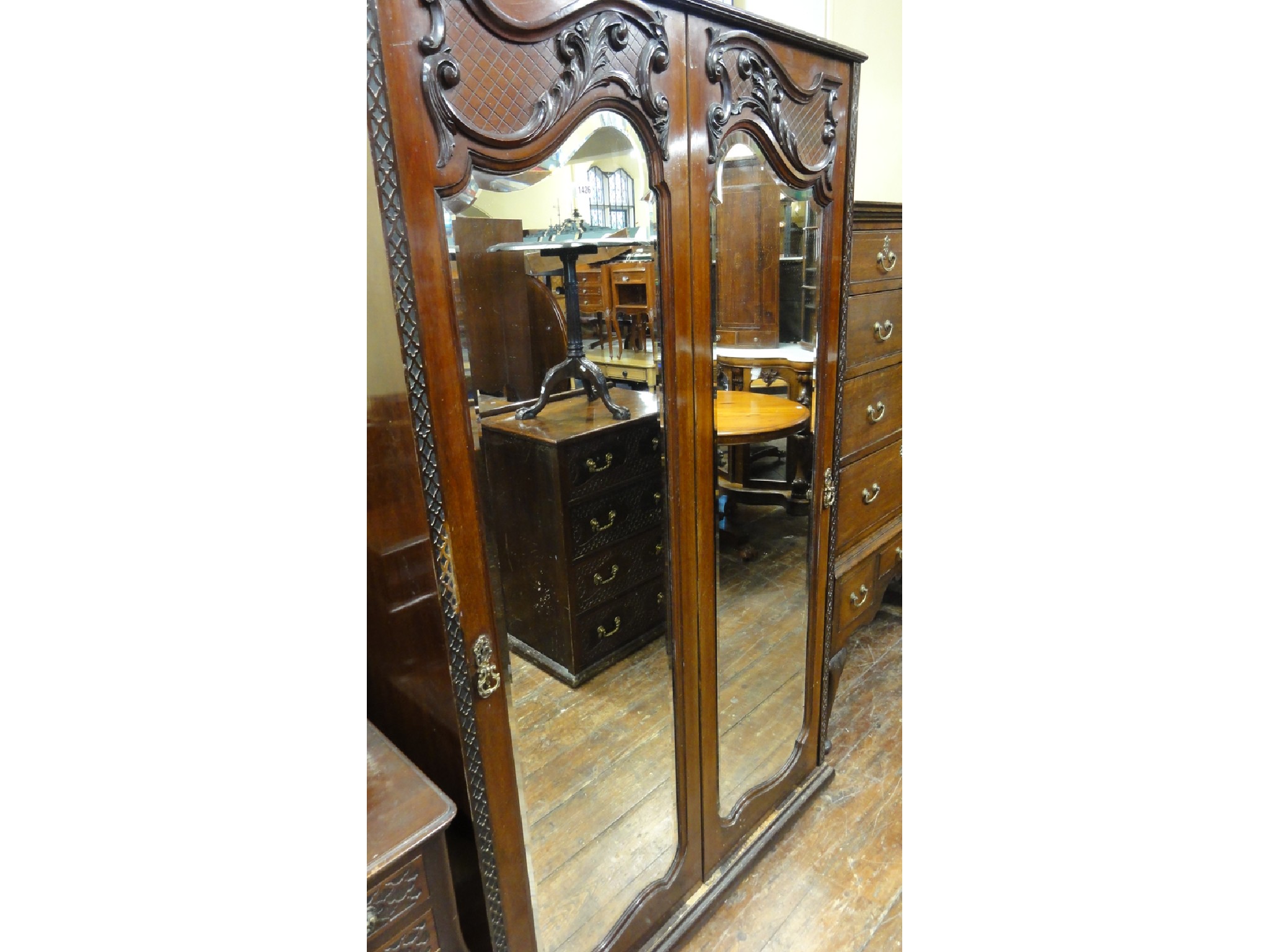 Appraisal: An Edwardian mahogany three piece bedroom suite comprising double wardrobe