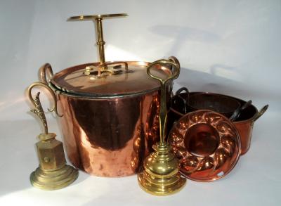 Appraisal: A two-handled copper pan with lid two door stops a