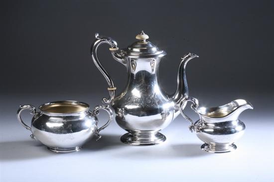 Appraisal: THREE-PIECE VICTORIAN ARMORIAL SILVER COFFEE SET London Coffee pot and